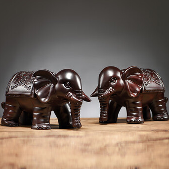 Paired Carved Elephant Figurines